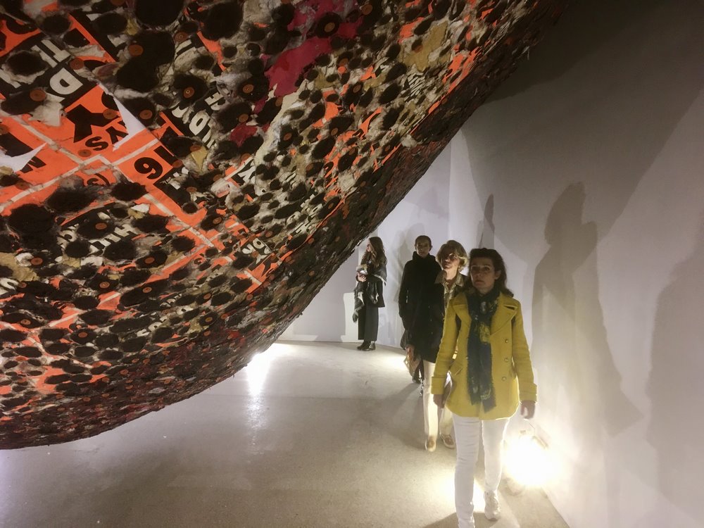 Visitors encountering Mark Bradford's work inside the U.S. Pavilion
